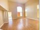 Bright living room with large windows and hardwood floors at 8760 Harvest Valley Ave, Las Vegas, NV 89129