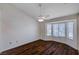 Spacious bedroom with dark wood flooring and a ceiling fan at 9320 Quail Ridge Dr, Las Vegas, NV 89134