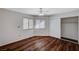 Spacious bedroom featuring wood-look floors, dual windows, and ample closet space at 9320 Quail Ridge Dr, Las Vegas, NV 89134