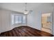 Bright bedroom with bay window, ceiling fan, and wood flooring at 9320 Quail Ridge Dr, Las Vegas, NV 89134