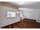 Dining area with kitchen pass-through and wood floors at 9320 Quail Ridge Dr, Las Vegas, NV 89134