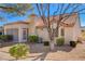 Back exterior view showing a house with a screened patio and landscaped yard at 9320 Quail Ridge Dr, Las Vegas, NV 89134