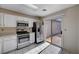 Kitchen with stainless steel appliances and patio access at 9320 Quail Ridge Dr, Las Vegas, NV 89134