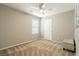 Bedroom with window, neutral decor, and ottoman at 9332 Newbattle St, Las Vegas, NV 89178