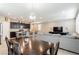 Bright dining room featuring a rich wood table, comfortable seating, and ample natural light at 9332 Newbattle St, Las Vegas, NV 89178