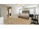 Main bedroom with king-size bed, en-suite bathroom, and home office at 9332 Newbattle St, Las Vegas, NV 89178