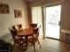 Charming dining area with wood table and chairs, plus sliding door access at 2119 Pebble Creek Ln, Laughlin, NV 89029