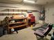 Organized garage with workbench and storage at 2119 Pebble Creek Ln, Laughlin, NV 89029