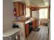 Well-equipped kitchen with wood cabinets and modern appliances at 2119 Pebble Creek Ln, Laughlin, NV 89029