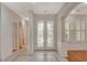 Elegant entryway with double doors and tile flooring at 10302 Cara Mia Ct, Las Vegas, NV 89135