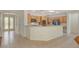 Open kitchen with island and stainless steel appliances at 10302 Cara Mia Ct, Las Vegas, NV 89135