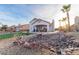 Artificial turf, rock landscaping and covered patio at 1215 Country Club Dr, Laughlin, NV 89029