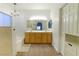 Bathroom with double sinks, large mirror, and soaking tub at 1215 Country Club Dr, Laughlin, NV 89029