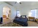 Bedroom with ensuite bathroom access and ceiling fan at 1215 Country Club Dr, Laughlin, NV 89029