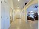 Bright and airy entryway with tile flooring and views into the living room at 1215 Country Club Dr, Laughlin, NV 89029