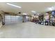 Spacious garage with ample storage shelving and flooring at 1215 Country Club Dr, Laughlin, NV 89029