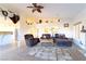 Open living room with high ceilings and a cozy fireplace at 1215 Country Club Dr, Laughlin, NV 89029