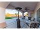 Covered patio with ceiling fan, heater, and comfortable seating at 1215 Country Club Dr, Laughlin, NV 89029