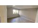 Spacious bedroom with large window and grey tile floors at 1420 Vegas Valley Dr # 23, Las Vegas, NV 89169