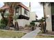 Exterior view of a two-story building with Spanish-style architecture and landscaping at 1420 Vegas Valley Dr # 23, Las Vegas, NV 89169