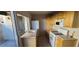 Kitchen with light wood cabinets, white appliances, and backyard access at 1420 Vegas Valley Dr # 23, Las Vegas, NV 89169
