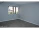 Bright living room with large window and grey tile floors at 1420 Vegas Valley Dr # 23, Las Vegas, NV 89169
