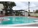 Community pool with surrounding patio furniture at 1420 Vegas Valley Dr # 23, Las Vegas, NV 89169