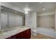 Bathroom with double sinks, tub and tile surround at 150 N Las Vegas Blvd # 1505, Las Vegas, NV 89101
