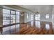 Bright living room with hardwood floors and city views from large windows at 150 N Las Vegas Blvd # 1505, Las Vegas, NV 89101