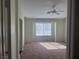 Spacious bedroom with neutral carpeting and large window at 16 Belle Essence Ave, Las Vegas, NV 89123