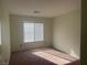 Simple bedroom with carpeted floors and window coverings at 16 Belle Essence Ave, Las Vegas, NV 89123