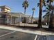 Community pool area with a pergola and palm trees at 16 Belle Essence Ave, Las Vegas, NV 89123
