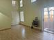 Entryway with wood floors, leading to the living room and upstairs at 16 Belle Essence Ave, Las Vegas, NV 89123