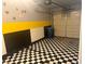 Garage with checkerboard floor and overhead door at 16 Belle Essence Ave, Las Vegas, NV 89123