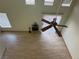 High-ceilinged living room with wood floor and ceiling fan at 16 Belle Essence Ave, Las Vegas, NV 89123
