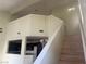 Staircase leading to upper level with kitchen view at 16 Belle Essence Ave, Las Vegas, NV 89123