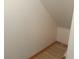 Small storage room with wood laminate floor and white walls at 16 Belle Essence Ave, Las Vegas, NV 89123