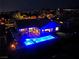 Luxury home with a large pool and backyard at night at 1999 Oliver Springs St, Henderson, NV 89052