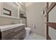 Modern bathroom with floating vanity and herringbone floors at 1999 Oliver Springs St, Henderson, NV 89052