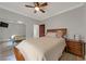 Spacious bedroom with ceiling fan and mirrored closet doors at 1999 Oliver Springs St, Henderson, NV 89052