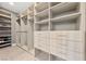 Bright walk-in closet with custom shelving and drawers at 1999 Oliver Springs St, Henderson, NV 89052