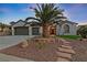 Single story home with two car garage and palm tree landscaping at 1999 Oliver Springs St, Henderson, NV 89052