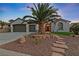 One-story home with palm tree and stone path at 1999 Oliver Springs St, Henderson, NV 89052