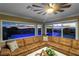 Relaxing Gathering room with sectional sofa, fireplace, and stunning pool views at 1999 Oliver Springs St, Henderson, NV 89052