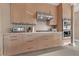 Modern kitchen with stainless steel appliances and light wood cabinets at 1999 Oliver Springs St, Henderson, NV 89052
