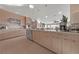 Modern kitchen with stainless steel appliances and light wood cabinets at 1999 Oliver Springs St, Henderson, NV 89052