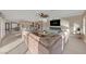 Open-concept living room with kitchen views and a cozy fireplace at 1999 Oliver Springs St, Henderson, NV 89052
