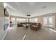 Spacious living room with large sectional sofa and linear fireplace at 1999 Oliver Springs St, Henderson, NV 89052
