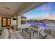 Outdoor patio furniture with pool view at 1999 Oliver Springs St, Henderson, NV 89052