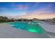 Modern pool and spa with light features at dusk at 1999 Oliver Springs St, Henderson, NV 89052